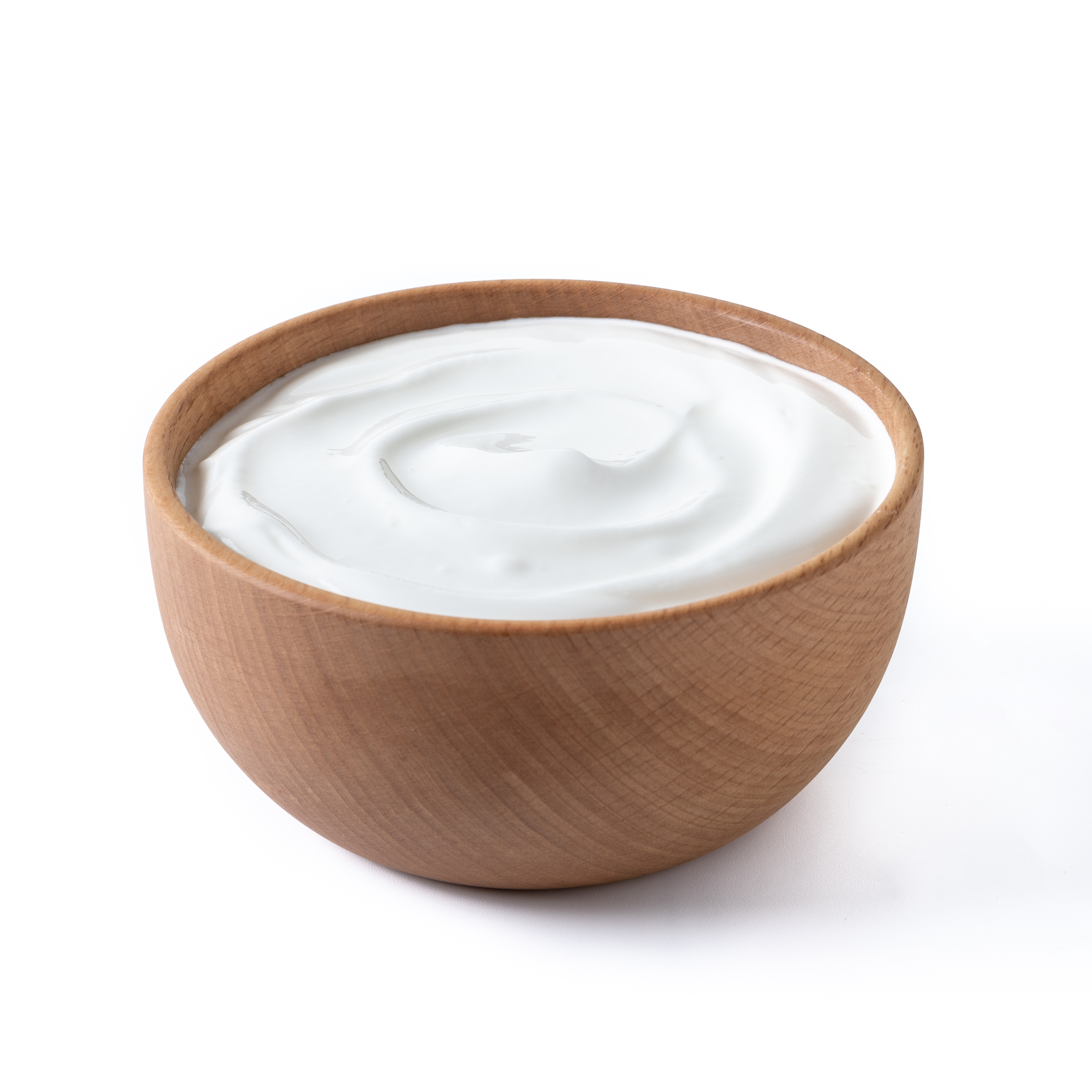 Greek yogurt in wooden bowl isolated on white background